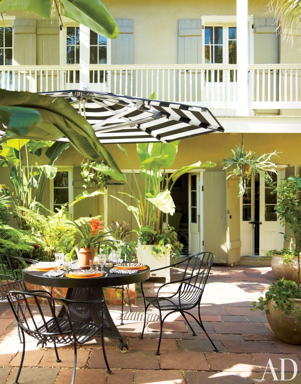 outdoor space striped umbrella garden furniture better decorating bible blog california banana tree palms potted plants