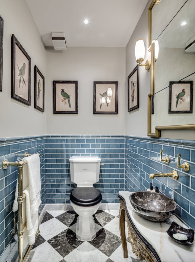 blue colored subway tiles gold hardware faucets decor checkered floor